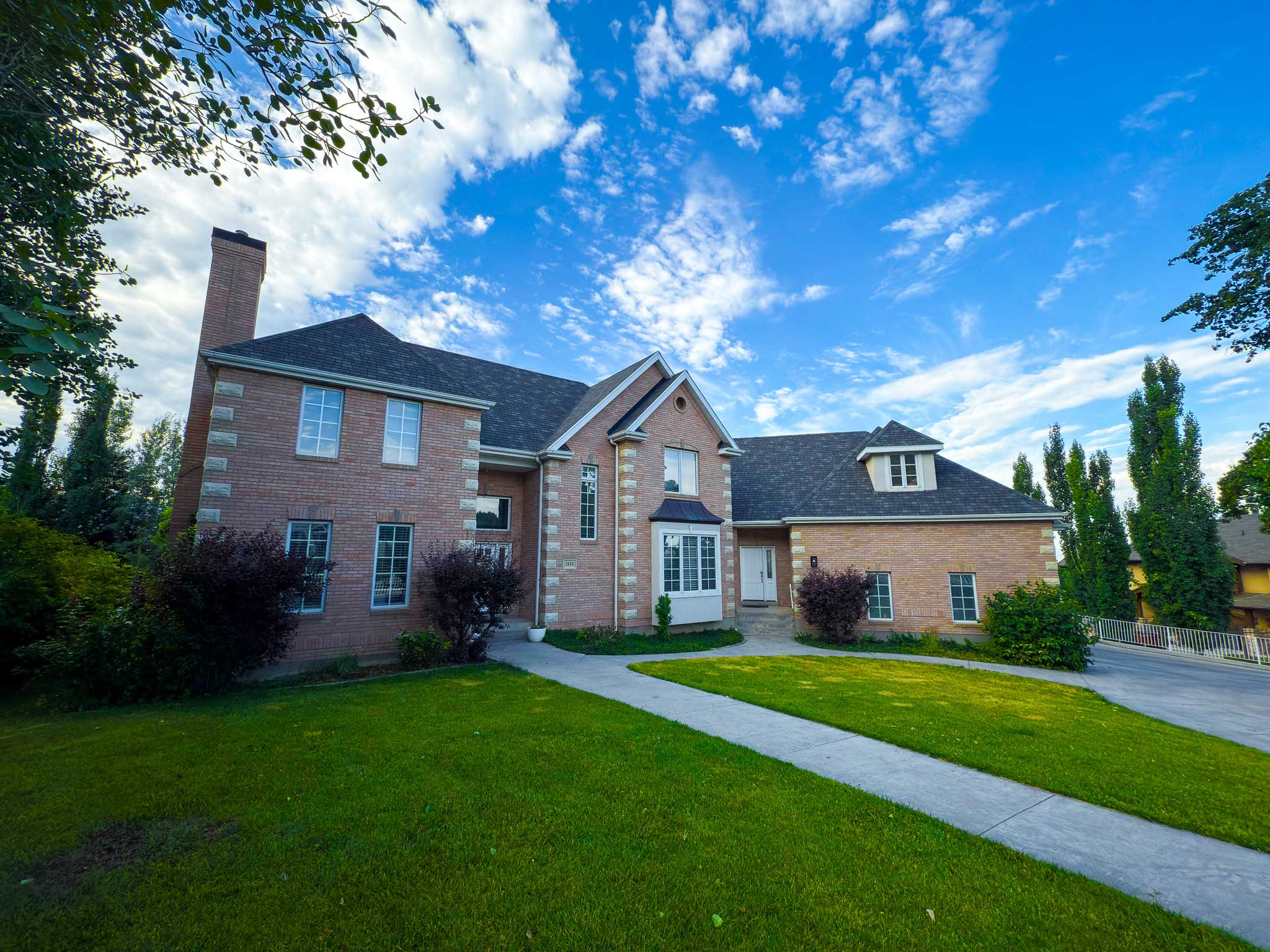 Metal roofing installation in Park City with stunning mountain views in the background.