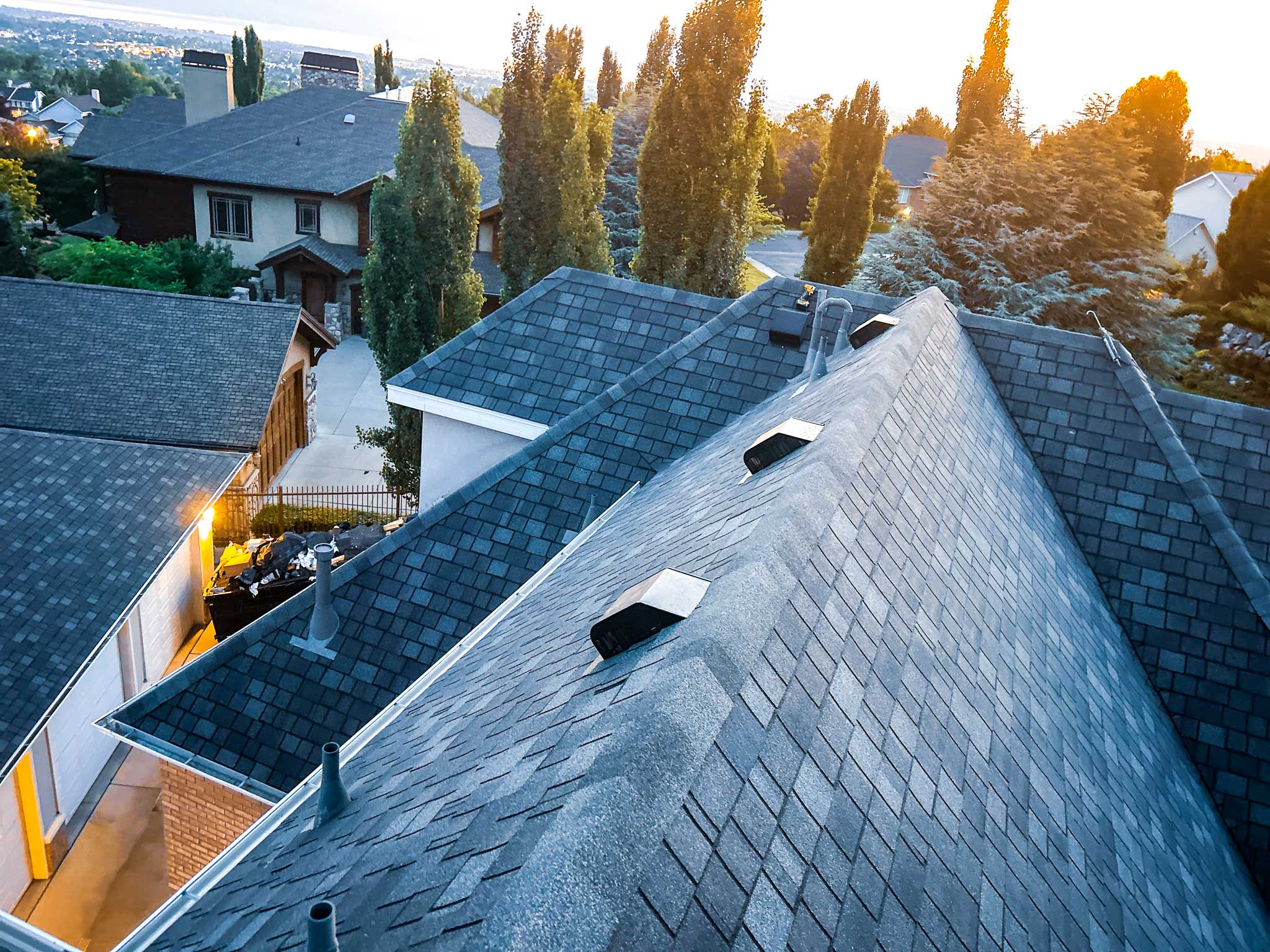 Metal roofing installation in Park City with stunning mountain views in the background.