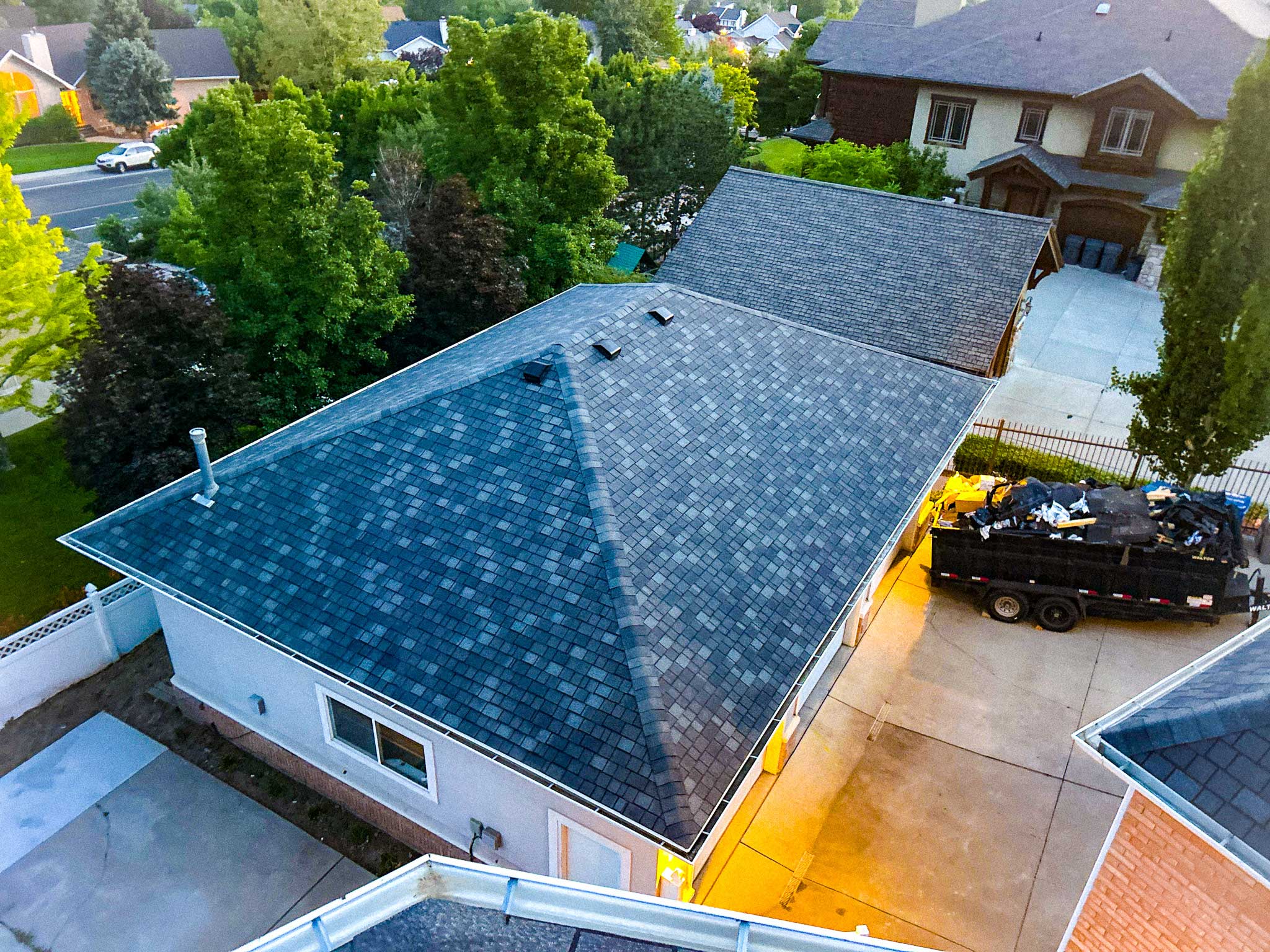 Metal roofing installation in Park City with stunning mountain views in the background.